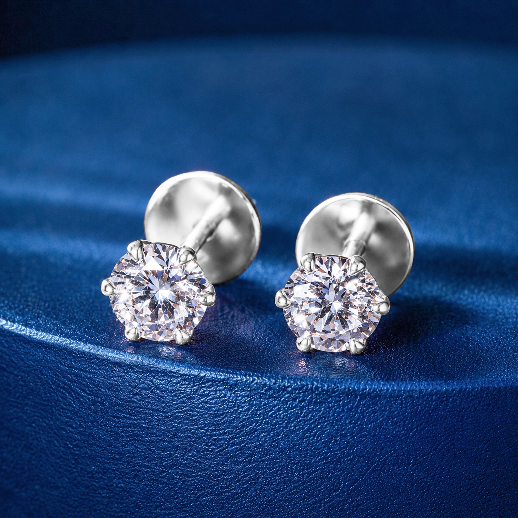 Round Brilliant Solitaire Stud Earrings — White Gold