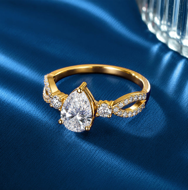Pear Cut Three-Stone Twisted Pavé Ring